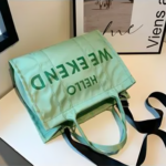 BOLSO DE MANO DE TELA WEEKEND